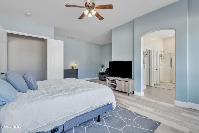 bedroom with ceiling fan and light wood-type flooring