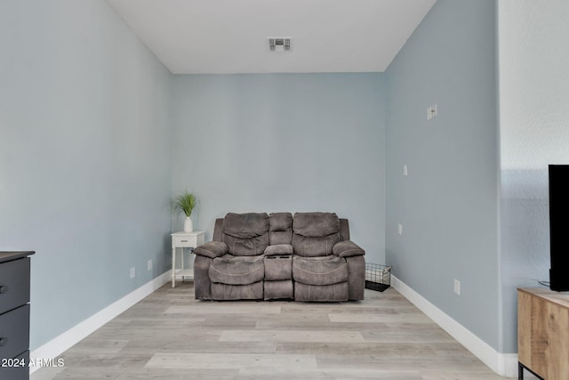 sitting room featuring light hardwood / wood-style flooring