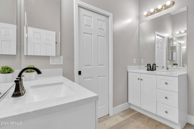 bathroom with hardwood / wood-style flooring and vanity