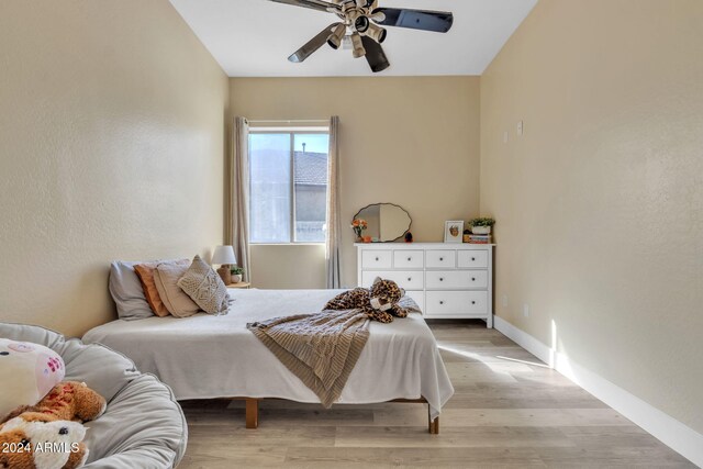 bedroom featuring light hardwood / wood-style flooring and ceiling fan