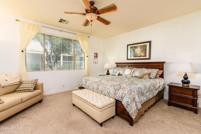 bedroom with baseboards, ceiling fan, visible vents, and carpet