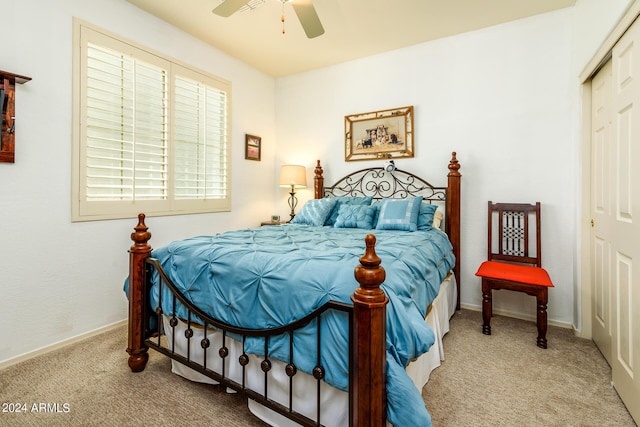 bedroom featuring baseboards, a closet, carpet floors, and a ceiling fan