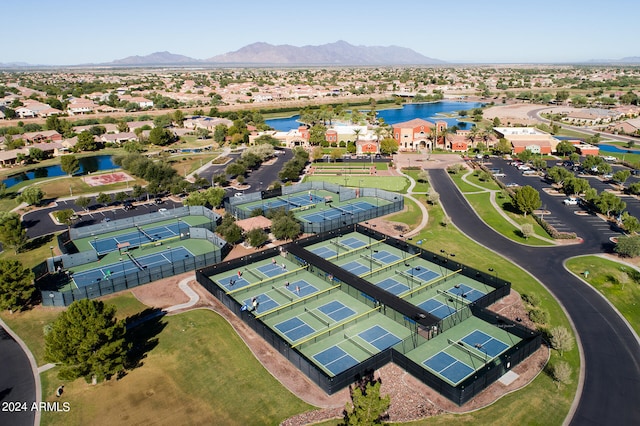 aerial view featuring a water and mountain view and a residential view