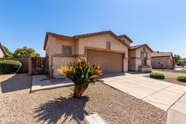 2732 E Tyson St, Chandler, AZ 85225 - mediterranean / spanish home with a gate, an attached garage, stucco siding, driveway, and fence