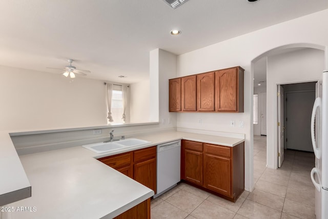 2732 E Tyson St, Chandler, AZ 85225 - kitchen featuring white appliances, a sink, a ceiling fan, arched walkways, and light countertops