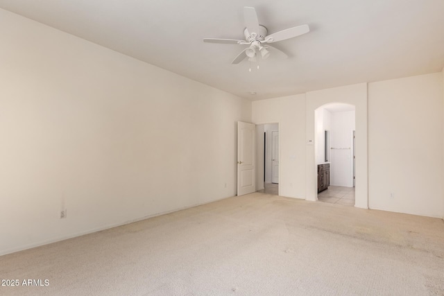 2732 E Tyson St, Chandler, AZ 85225 - spare room with arched walkways, light colored carpet, and ceiling fan