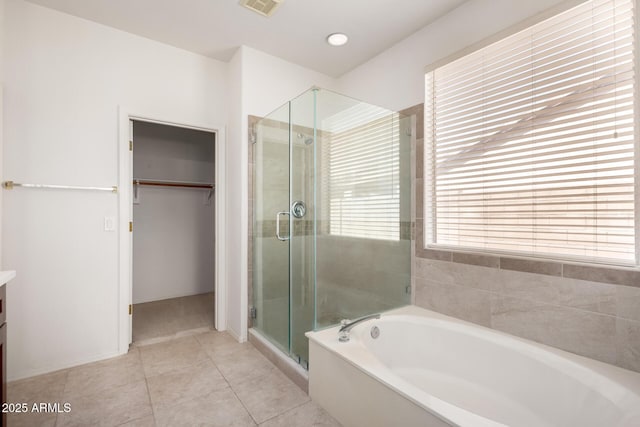 2732 E Tyson St, Chandler, AZ 85225 - full bathroom with a shower stall, a spacious closet, vanity, a garden tub, and tile patterned floors