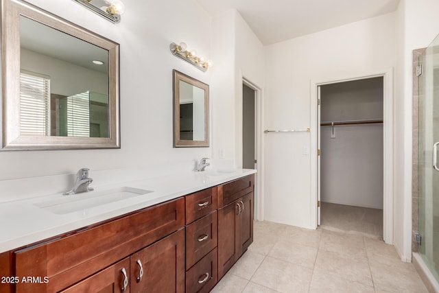 2732 E Tyson St, Chandler, AZ 85225 - bathroom featuring a stall shower, tile patterned flooring, double vanity, and a walk in closet