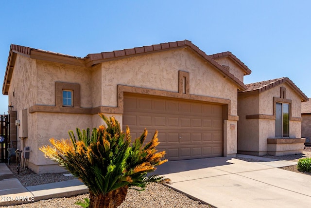 2732 E Tyson St, Chandler, AZ 85225 - view of front facade featuring an attached garage, driveway, stucco siding, and a tiled roof