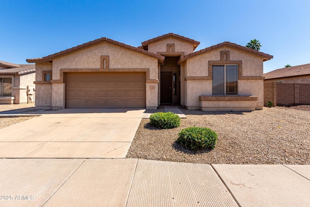 2732 E Tyson St, Chandler, AZ 85225 - mediterranean / spanish-style house featuring a garage, concrete driveway, stucco siding, fence, and a tiled roof