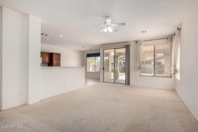 2732 E Tyson St, Chandler, AZ 85225 - unfurnished living room featuring light carpet, ceiling fan, and recessed lighting