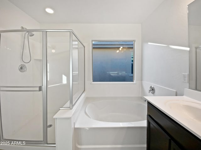 bathroom with recessed lighting, a shower stall, a bath, and vanity