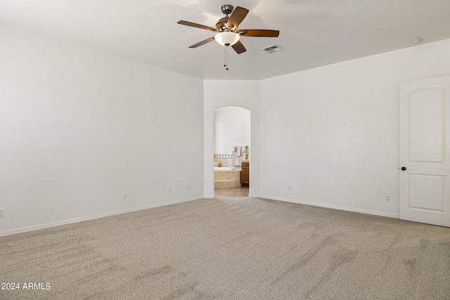 unfurnished room featuring light colored carpet and ceiling fan