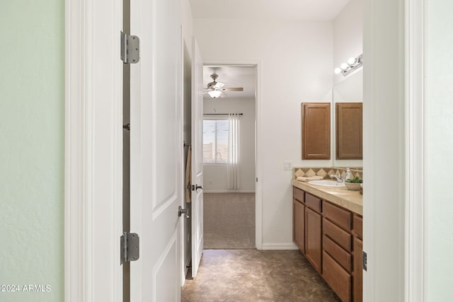 bathroom featuring tile patterned floors, vanity, and ceiling fan