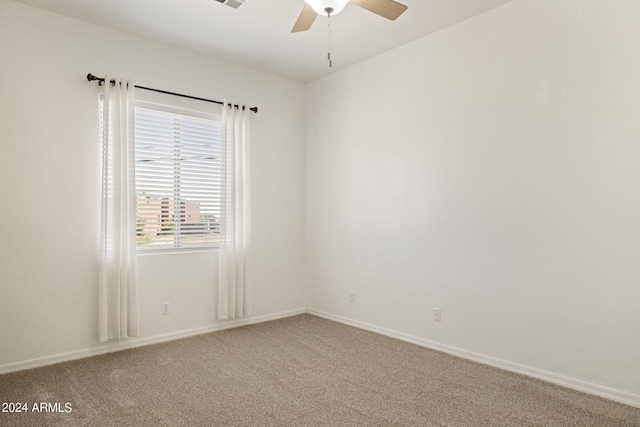 unfurnished room with carpet floors and ceiling fan