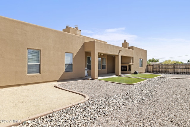 rear view of property featuring a patio area