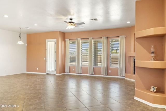 unfurnished room featuring ceiling fan