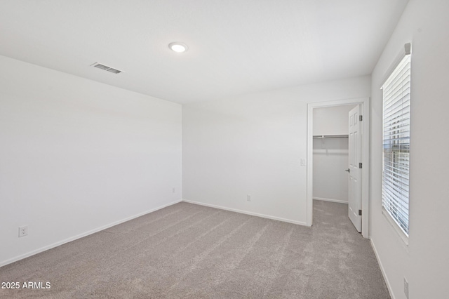 5535 S 240th Ln, Buckeye, AZ 85326 - unfurnished bedroom with carpet, a walk in closet, and a closet