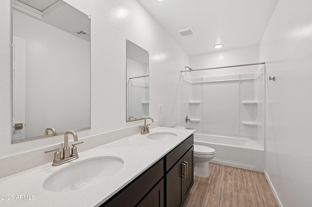 5535 S 240th Ln, Buckeye, AZ 85326 - bathroom featuring shower / washtub combination, double vanity, and wood finished floors