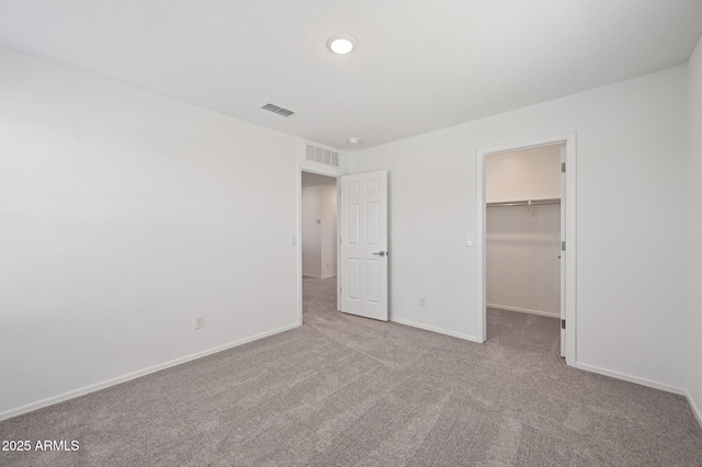 5535 S 240th Ln, Buckeye, AZ 85326 - unfurnished bedroom with carpet flooring, a walk in closet, and a closet