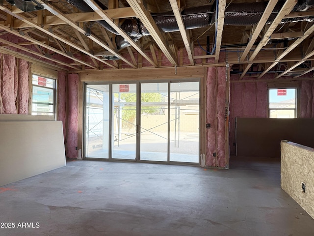 5535 S 240th Ln, Buckeye, AZ 85326 - misc room featuring plenty of natural light and concrete flooring