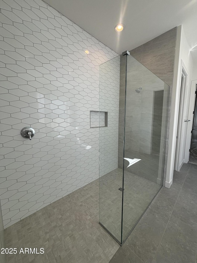 full bath with tiled shower, tile patterned floors, and recessed lighting