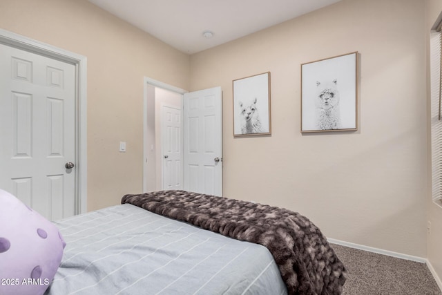 carpeted bedroom with a closet