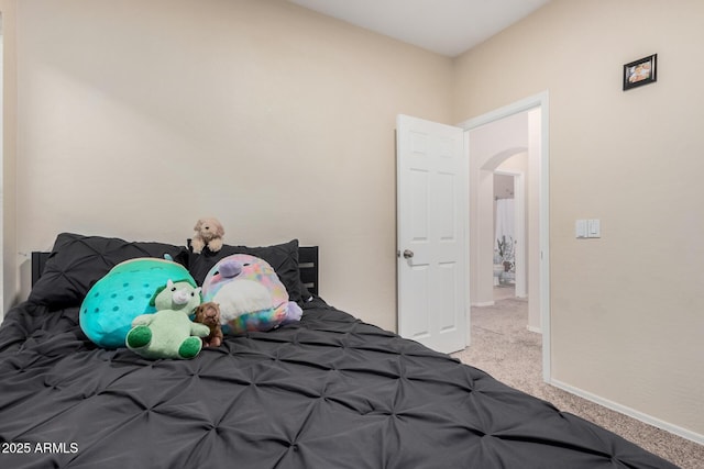 bedroom featuring light colored carpet