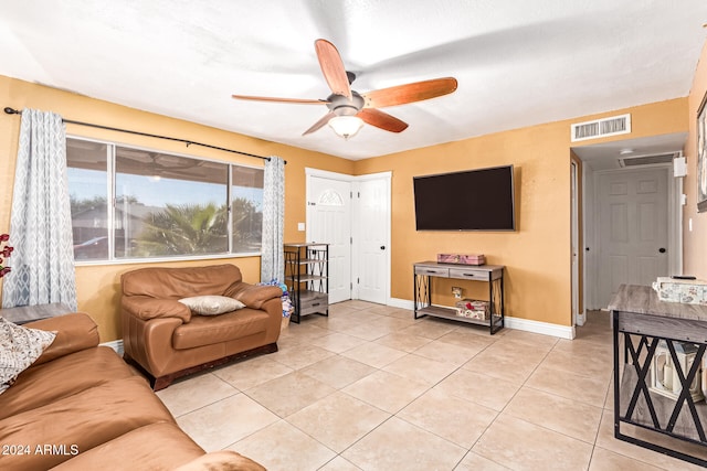 living room featuring ceiling fan and light tile patterned flooring