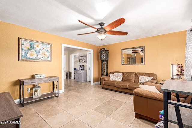 living room featuring light tile patterned flooring and ceiling fan