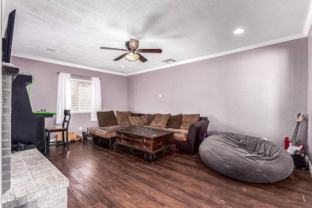 living room featuring crown molding, ceiling fan, a textured ceiling, and dark hardwood / wood-style flooring