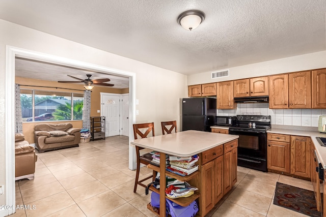 kitchen featuring black appliances, tasteful backsplash, light tile patterned floors, a textured ceiling, and ceiling fan