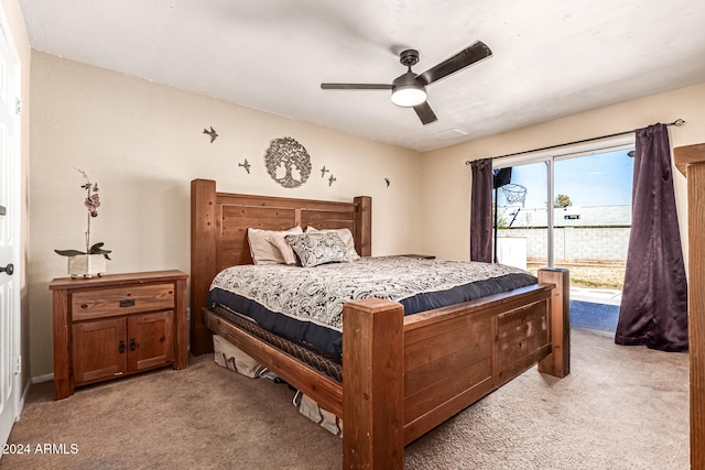 bedroom featuring light carpet, access to outside, and ceiling fan