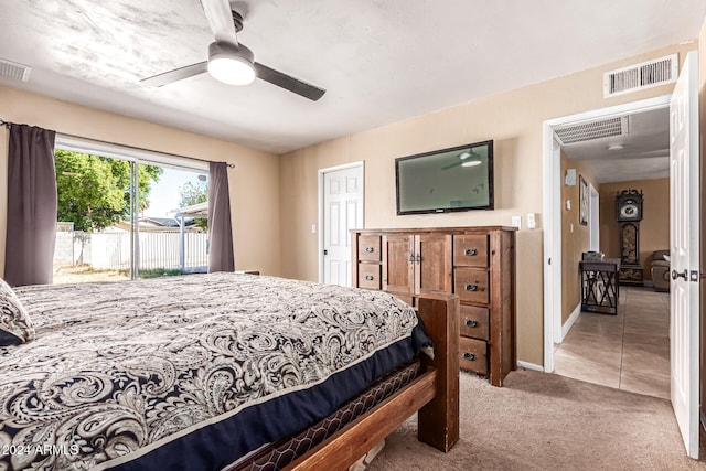 carpeted bedroom with access to outside and ceiling fan