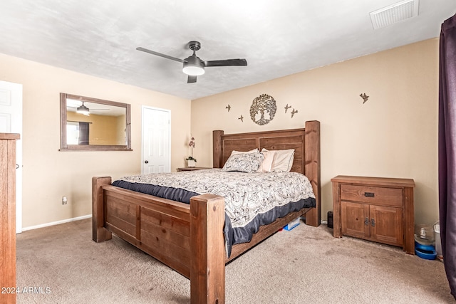 bedroom featuring light colored carpet and ceiling fan