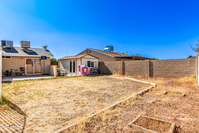 view of yard with a patio area and cooling unit