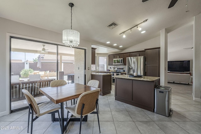 1461 W Tara Dr, Gilbert, AZ 85233 - dining space with a ceiling fan, lofted ceiling, light tile patterned floors, a chandelier, and baseboards