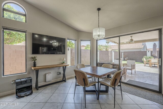 1461 W Tara Dr, Gilbert, AZ 85233 - tiled dining area with lofted ceiling, a chandelier, ceiling fan, and baseboards