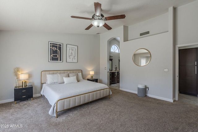 1461 W Tara Dr, Gilbert, AZ 85233 - bedroom with carpet, arched walkways, ensuite bathroom, baseboards, and lofted ceiling