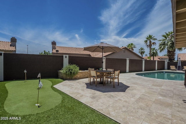 1461 W Tara Dr, Gilbert, AZ 85233 - view of swimming pool with a putting area, a patio, and a fenced backyard