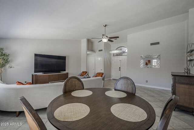 1461 W Tara Dr, Gilbert, AZ 85233 - dining room with light tile patterned floors, ceiling fan, high vaulted ceiling, and baseboards