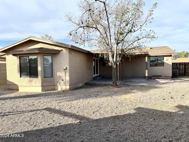 back of property with a patio area