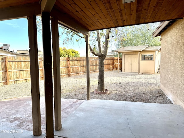 view of patio / terrace featuring a storage unit