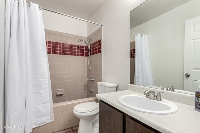 full bathroom featuring shower / bath combo with shower curtain, vanity, and toilet