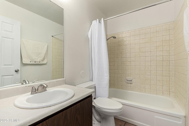 full bathroom featuring shower / bath combo, vanity, and toilet