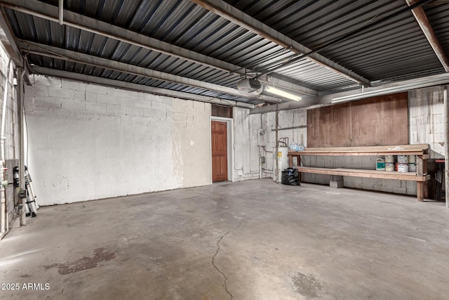 garage with a workshop area and a garage door opener