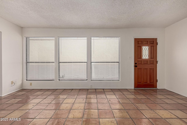 entrance foyer featuring a textured ceiling