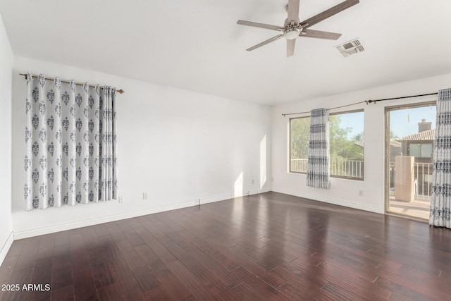 empty room with visible vents, baseboards, a ceiling fan, and wood finished floors