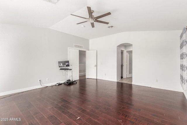 interior space featuring arched walkways, a ceiling fan, visible vents, wood finished floors, and lofted ceiling