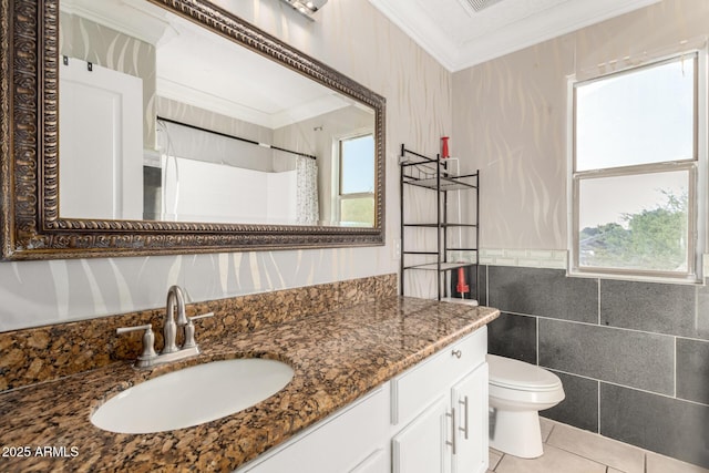 full bathroom with toilet, crown molding, a wealth of natural light, and tile walls
